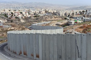 The Israeli separation wall divides the Pisgat Zeev Israeli Settlement, on the left, and the Shuafat Refugee Camp, on the right, outside Jerusalem, January 25, 2011. Al-Jazeera released leaked documents called the 